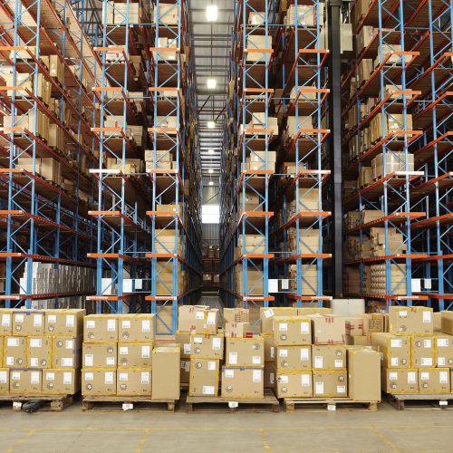 Boxes and racking inside a modern warehouse storing boxes of clothing